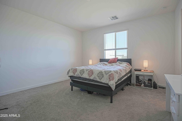 bedroom featuring light colored carpet