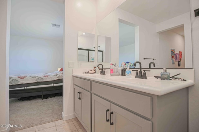 bathroom with vanity and tile patterned flooring