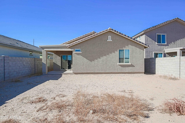 back of property with a patio area