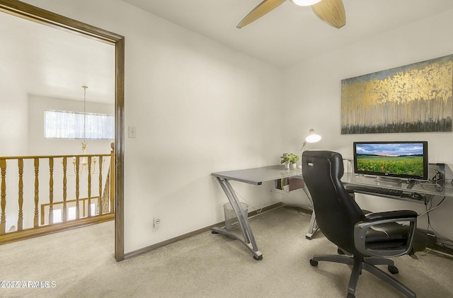carpeted office with baseboards and ceiling fan