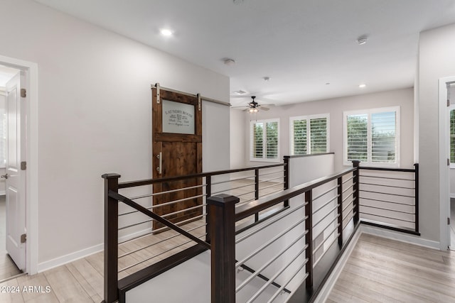 hall with light hardwood / wood-style flooring