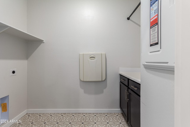 washroom with hookup for an electric dryer