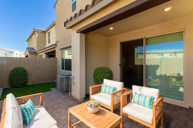 view of patio with outdoor lounge area and central air condition unit