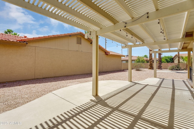 view of patio / terrace with a fenced backyard and a pergola