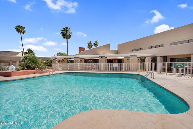 community pool featuring fence