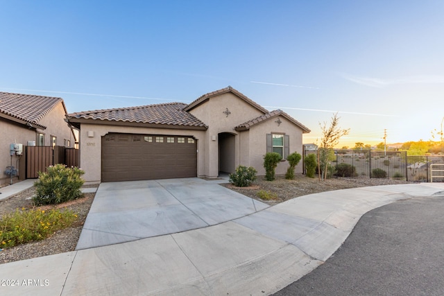 mediterranean / spanish-style home featuring a garage