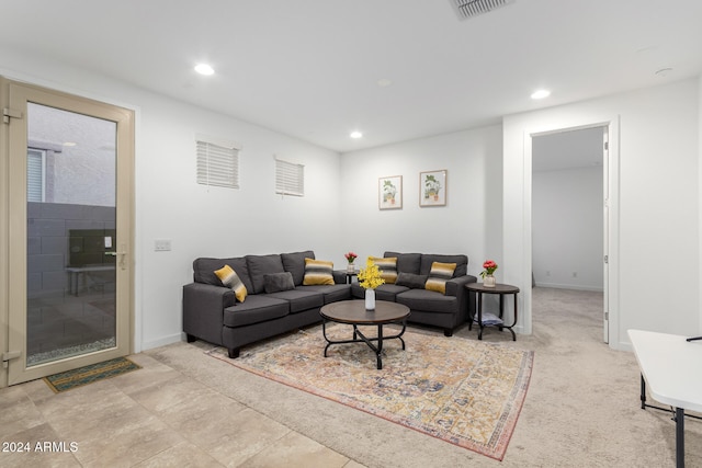 living room with light colored carpet