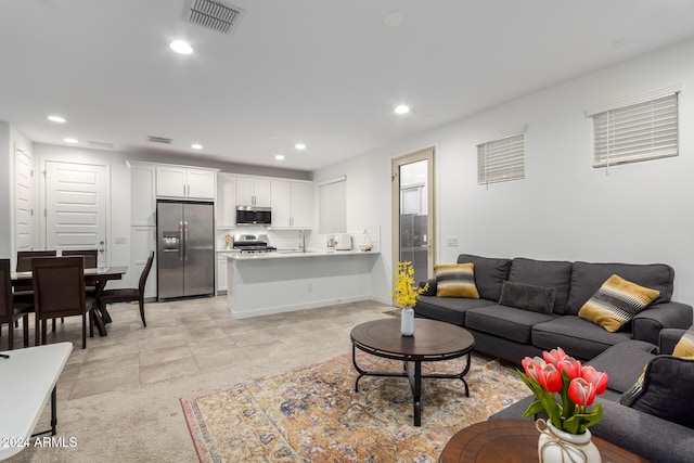 living room featuring sink