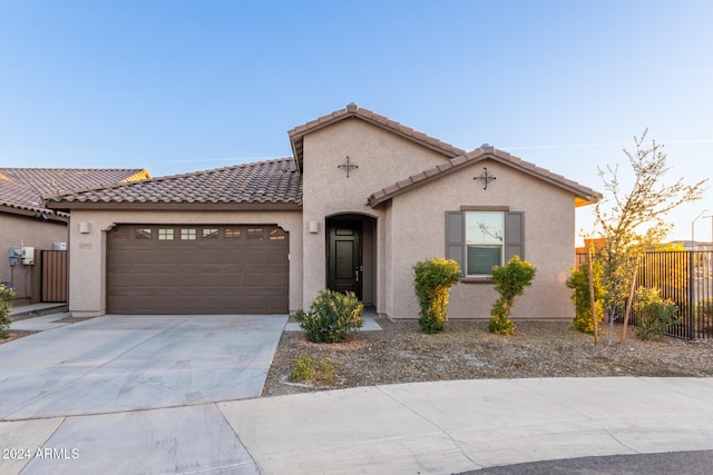 mediterranean / spanish-style house featuring a garage