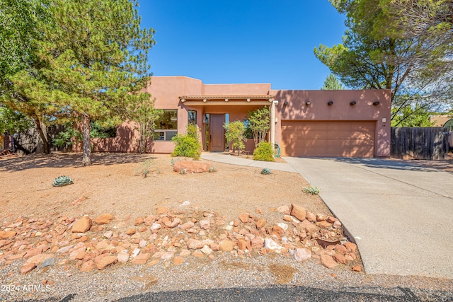 southwest-style home with a garage