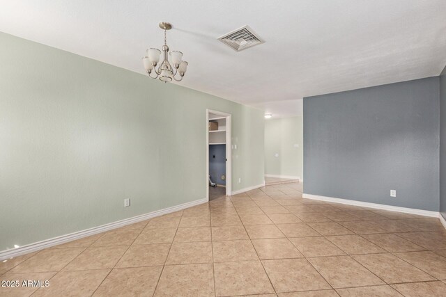 2161 E Harmony Cir, Mesa, AZ 85204 - empty room featuring a chandelier and light tile patterned floors