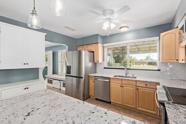 2161 E Harmony Cir, Mesa, AZ 85204 - kitchen featuring stainless steel appliances, tasteful backsplash, light stone countertops, and a ceiling fan