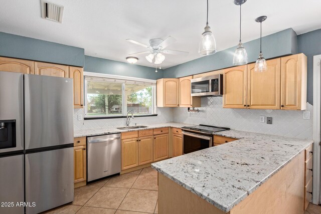 2161 E Harmony Cir, Mesa, AZ 85204 - kitchen with appliances with stainless steel finishes, tasteful backsplash, light brown cabinets, and a peninsula