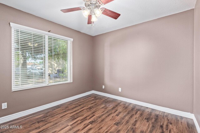 2161 E Harmony Cir, Mesa, AZ 85204 - spare room with dark wood-type flooring and a ceiling fan
