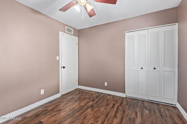 2161 E Harmony Cir, Mesa, AZ 85204 - unfurnished bedroom with wood finished floors, a closet, and ceiling fan