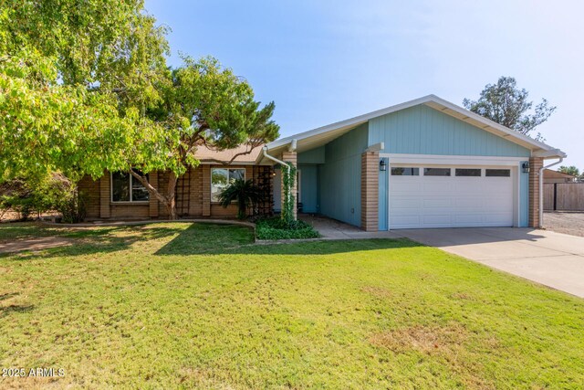 2161 E Harmony Cir, Mesa, AZ 85204 - view of front of home with an attached garage, concrete driveway, and brick siding