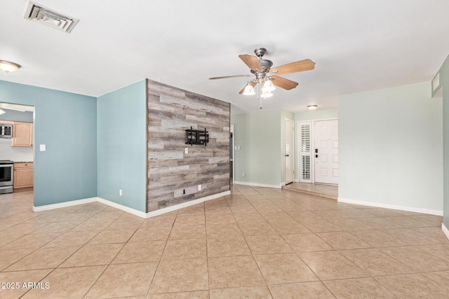 2161 E Harmony Cir, Mesa, AZ 85204 - empty room featuring ceiling fan, light tile patterned floors, and wood walls