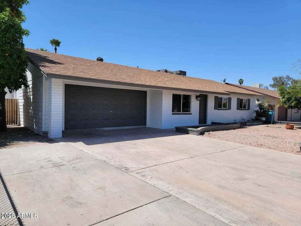4225 W Echo Ln, Phoenix, AZ 85051 - single story home with an attached garage and concrete driveway