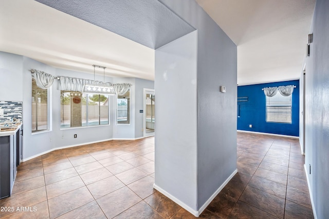 1638 N Avoca, Mesa, AZ 85207 - kitchen featuring plenty of natural light, tile patterned flooring, and baseboards