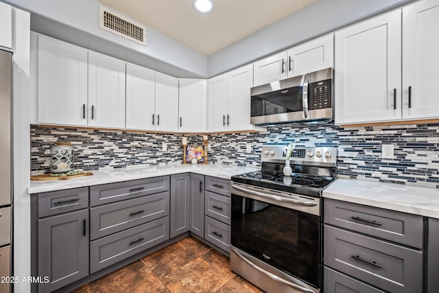 1638 N Avoca, Mesa, AZ 85207 - kitchen with stainless steel appliances, gray cabinetry, tasteful backsplash, and recessed lighting