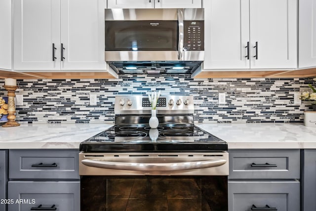 1638 N Avoca, Mesa, AZ 85207 - kitchen with stainless steel appliances, gray cabinetry, white cabinetry, and decorative backsplash