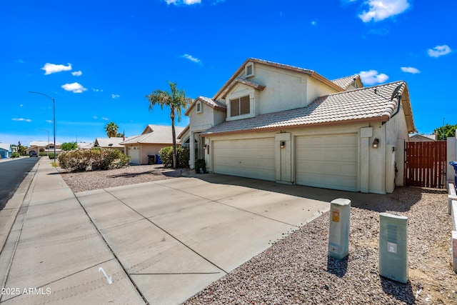 1638 N Avoca, Mesa, AZ 85207 - view of front of property with stucco siding, driveway, a tiled roof, and an attached garage