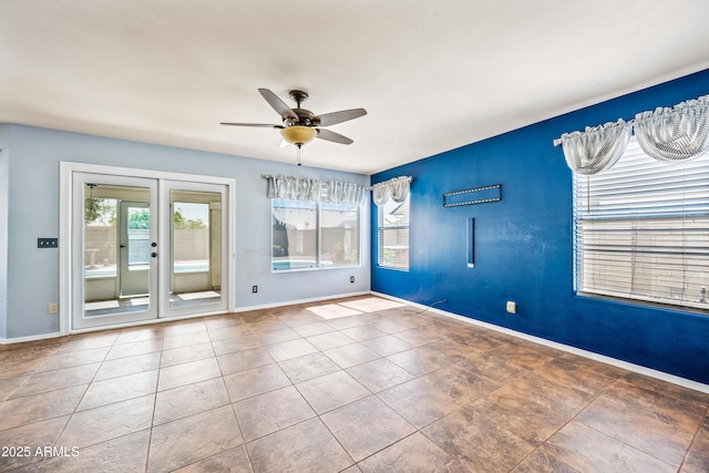 1638 N Avoca, Mesa, AZ 85207 - tiled spare room with a ceiling fan and baseboards