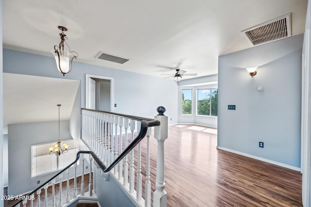 1638 N Avoca, Mesa, AZ 85207 - hallway with an upstairs landing, wood finished floors, a chandelier, and baseboards