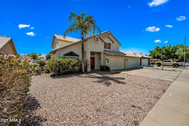 1638 N Avoca, Mesa, AZ 85207 - view of front of property featuring concrete driveway, a garage, stucco siding, and a tile roof