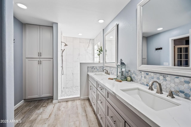 1638 N Avoca, Mesa, AZ 85207 - full bathroom featuring a tile shower, double vanity, wood finished floors, recessed lighting, and baseboards