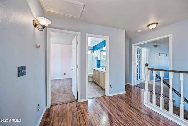 1638 N Avoca, Mesa, AZ 85207 - hallway featuring dark wood-type flooring, an upstairs landing, baseboards, and a sink