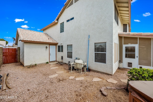 1638 N Avoca, Mesa, AZ 85207 - back of property featuring stucco siding, a gate, and a tiled roof
