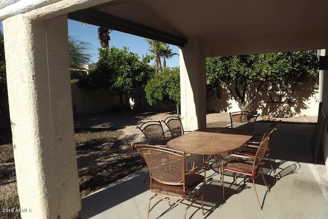 view of patio with a fenced backyard and outdoor dining space