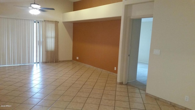 unfurnished room featuring light tile patterned floors and a ceiling fan