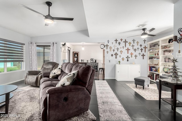 living area featuring visible vents, dark tile patterned floors, vaulted ceiling, and a ceiling fan