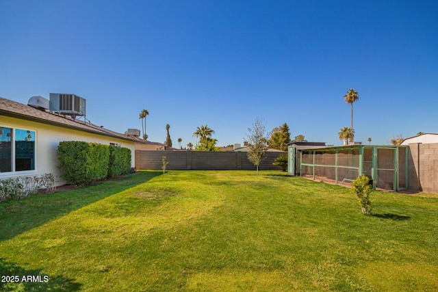 view of yard featuring cooling unit and a fenced backyard