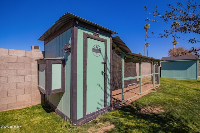 view of poultry coop with a lawn