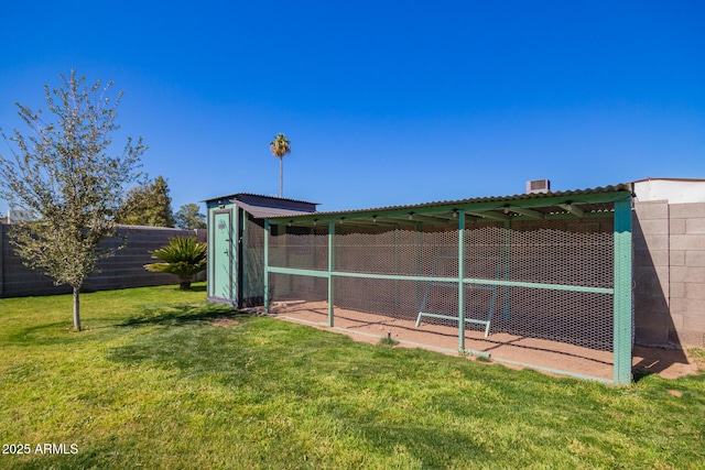 view of poultry coop featuring a yard and fence