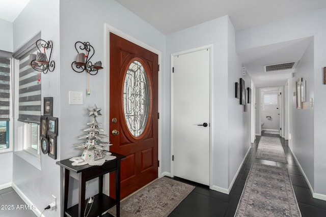 foyer with visible vents and baseboards