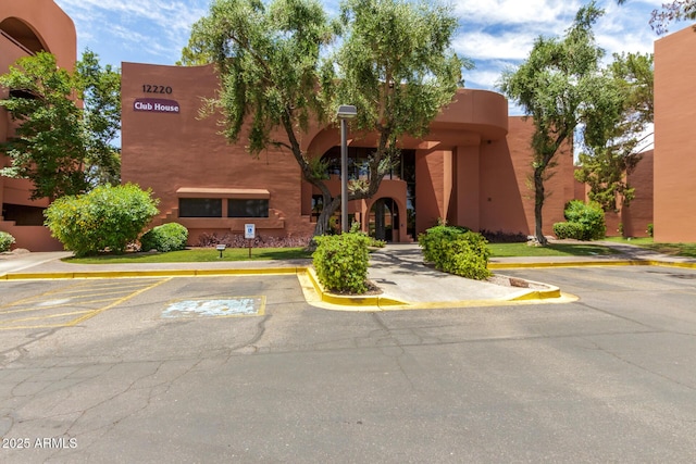 view of property with uncovered parking