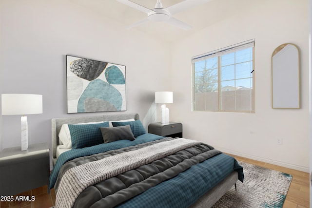 bedroom with ceiling fan and wood-type flooring