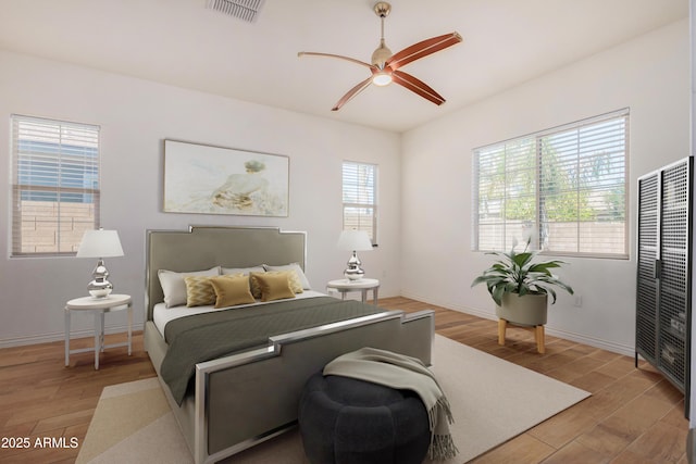 bedroom featuring hardwood / wood-style flooring and ceiling fan