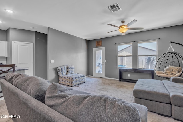 6085 E Athena Rd, Florence, AZ 85132 - living area featuring a ceiling fan, light colored carpet, and recessed lighting