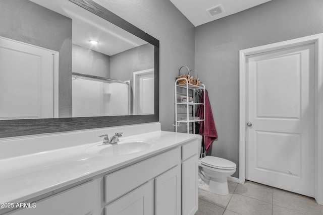 6085 E Athena Rd, Florence, AZ 85132 - bathroom featuring vanity, tile patterned flooring, and a shower