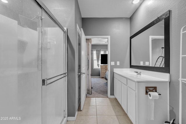 6085 E Athena Rd, Florence, AZ 85132 - full bathroom with a shower stall, ensuite bathroom, vanity, and tile patterned floors
