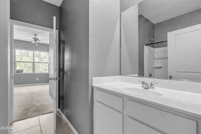 6085 E Athena Rd, Florence, AZ 85132 - bathroom with vanity, ceiling fan, tile patterned floors, and a shower
