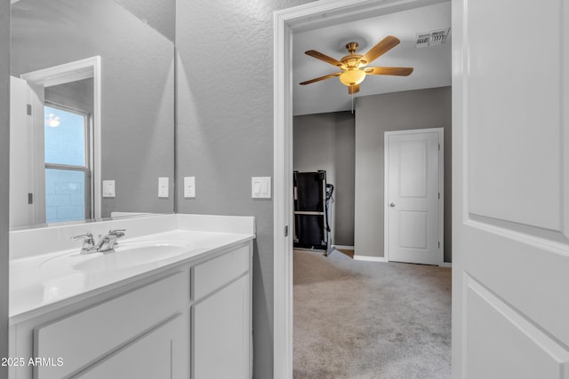 6085 E Athena Rd, Florence, AZ 85132 - bathroom with ceiling fan and vanity