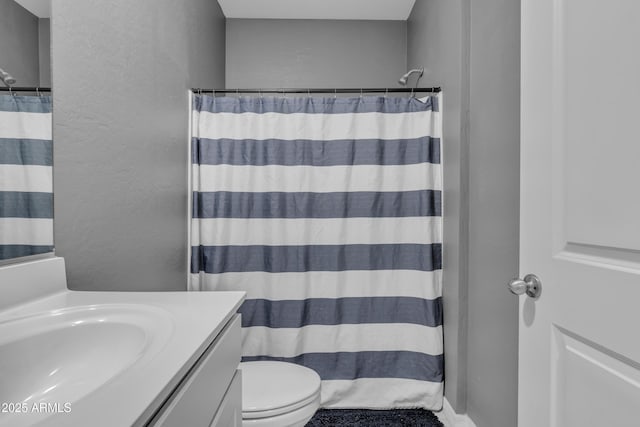 6085 E Athena Rd, Florence, AZ 85132 - full bathroom featuring vanity, a textured wall, and curtained shower