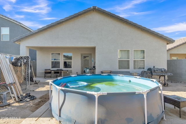 6085 E Athena Rd, Florence, AZ 85132 - rear view of property with stucco siding