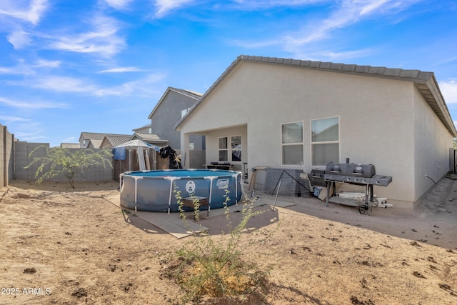 6085 E Athena Rd, Florence, AZ 85132 - back of house featuring a fenced backyard and stucco siding